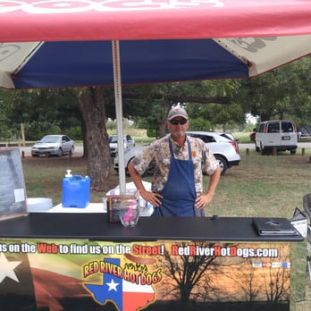 Red River Hot Dogs - Owner and operator Brian cookin up some dogs at falls fest - Food Stands Near Me Red River Hot Dogs - Owner and operator Brian cookin up some dogs at falls fest - Food Stands Near Me