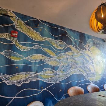 Screaming Tuna Mequon - a dining room with a painting on the wall - Sushi Bars Near Me - Mequon, Wisconsin Screaming Tuna Mequon - a dining room with a painting on the wall - Sushi Bars Near Me - Mequon, Wisconsin