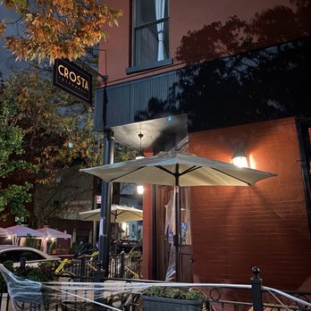 Crosta - the outside of a restaurant at night - Pizza Near Me - Brooklyn, New York