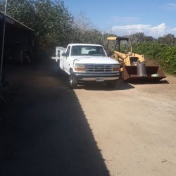 Johnny's Mobile Mechanic - A tractor in progress of repair with the company service truck