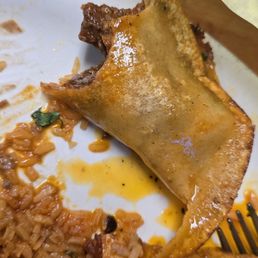 Quesabirria taco with burnt shell removed to reveal nice soft tortilla shell