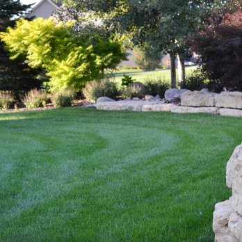 SunCo - a stone wall in a backyard - Irrigation Near Me - Omaha, Nebraska SunCo - a stone wall in a backyard - Irrigation Near Me - Omaha, Nebraska