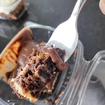Molly's - a piece of chocolate cake with a fork - American Near Me - Provo, Utah