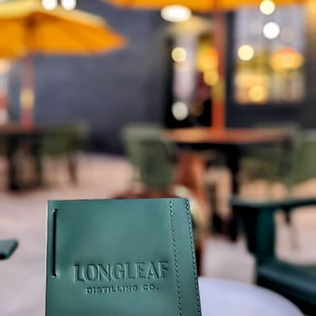 Longleaf Distilling - a person holding a book - Distilleries Near Me - Macon-Bibb County, Georgia