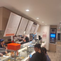 customers ordering food at the counter customers ordering food at the counter