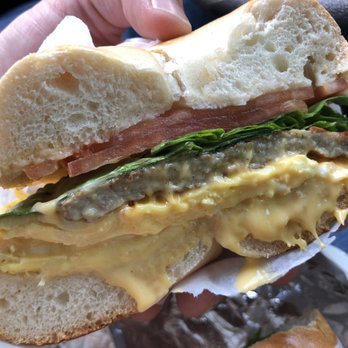 Glendale Bagels & Quality Deli - Sausage, egg, and ooey gooey cheese with lettuce and tomato on a plain bagel. - Bagels Near Me - Glendale, New York Glendale Bagels & Quality Deli - Sausage, egg, and ooey gooey cheese with lettuce and tomato on a plain bagel. - Bagels Near Me - Glendale, New York