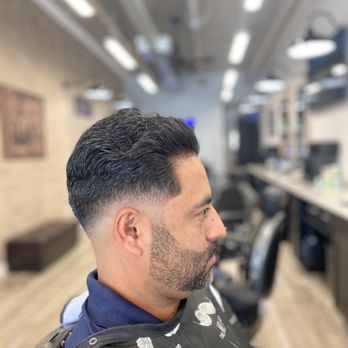 Upper Cuts Barbershop - Low skin fade with the top pushed backwards - Barbers Near Me - Miami, Florida Upper Cuts Barbershop - Low skin fade with the top pushed backwards - Barbers Near Me - Miami, Florida