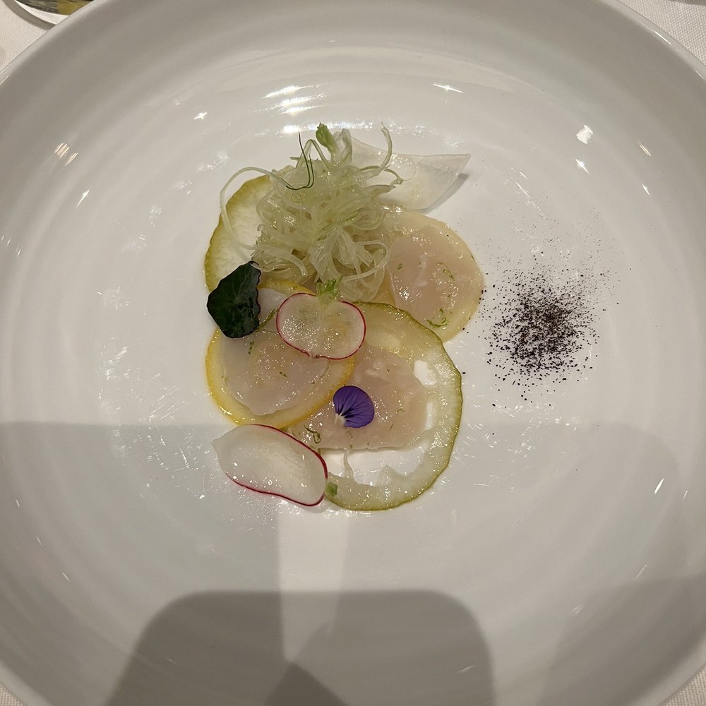 Scallop carpaccio -- very fresh and clean though I found the pickled lemon to be a bit too sour Scallop carpaccio -- very fresh and clean though I found the pickled lemon to be a bit too sour