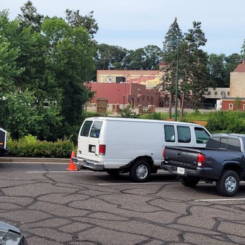 Leinie Lodge - Parking lot and brewery across the river. - Breweries Near Me - Chippewa Falls, Wisconsin