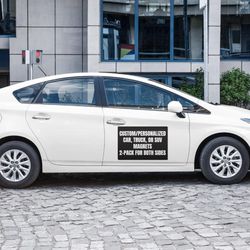 Capturing attention on the move! A sleek car adorned with a vibrant, custom-designed magnetic sign. The magnet effortlessly adheres car