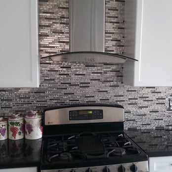 Gem Stones Inc - a kitchen with stainless steel appliances - Flooring Near Me - Concord, Ontario