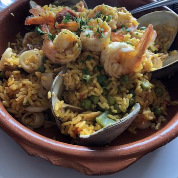 Tango Argentinian Steakhouse - Seafood paella with sausage and chicken- seafood included a shrimp, squid, mussels, and clams. - Steakhouses Near Me - Central Islip, New York Tango Argentinian Steakhouse - Seafood paella with sausage and chicken- seafood included a shrimp, squid, mussels, and clams. - Steakhouses Near Me - Central Islip, New York