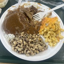 Donnie's Country Cookin - Salisbury steak over rice with Mac and cheese and black eyed peas. Super huge portions ! Amazing flavor!