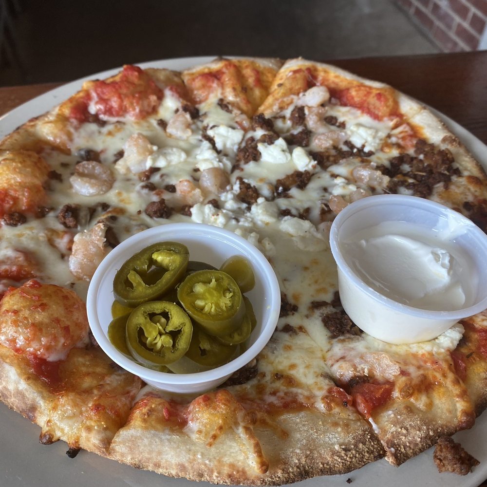Boondoggles Pub - Tejas Pizza with shrimp added and jalapeños and sour cream on the side. - Bars Near Me - El Lago, Texas