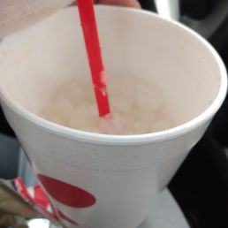 ows a person pouring a drink into a cup ows a person pouring a drink into a cup