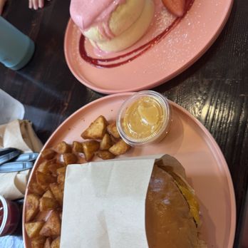 Burnt Crumbs - Pastrami Hash + Egg + Cheddar sandwich // strawberry Souffle Pancakes (2 per order) - New American Near Me - Irvine, California