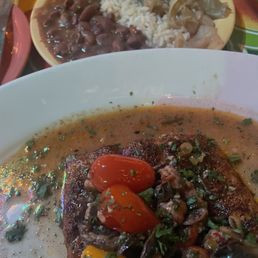 Grouper Iberville, red beans and rice, stewed cabbage Grouper Iberville, red beans and rice, stewed cabbage