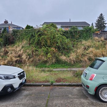 GRN Space Landscapes - two cars parked in a parking lot - Lawn Services Near Me GRN Space Landscapes - two cars parked in a parking lot - Lawn Services Near Me