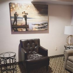 D. Hotel and Suites - Living room area