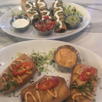 Vibez Lounge - Mini chimis with a chipotle sauce and taquitos with crema, pick and guac sauce on the side - Lounges Near Me - Fresno, California Vibez Lounge - Mini chimis with a chipotle sauce and taquitos with crema, pick and guac sauce on the side - Lounges Near Me - Fresno, California