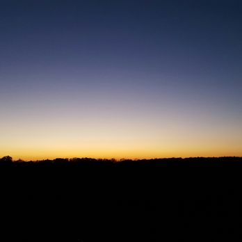 Apple Country Farm Market - a silhouette of a tree at sunset - Fruits & Veggies Near Me - Spring Valley, Ohio Apple Country Farm Market - a silhouette of a tree at sunset - Fruits & Veggies Near Me - Spring Valley, Ohio