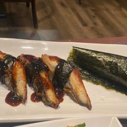 Fresh water eel nigiri sushi and salmon skin handroll