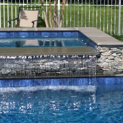Crystal Blue Aquatics - We did a 6 foot waterfall and a heavier than normal pump to push the waterfall over correctly.