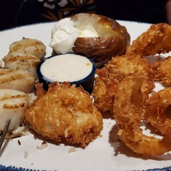 Red Lobster - Pick 2 wood fired scallops and coconut shrimp w/ baked potato - Seafood Near Me - New Hartford, New York Red Lobster - Pick 2 wood fired scallops and coconut shrimp w/ baked potato - Seafood Near Me - New Hartford, New York
