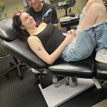 Adrenaline Studios Tattoo - Humoring mom for a picture - Tattoo Near Me - Des Moines, Iowa Adrenaline Studios Tattoo - Humoring mom for a picture - Tattoo Near Me - Des Moines, Iowa