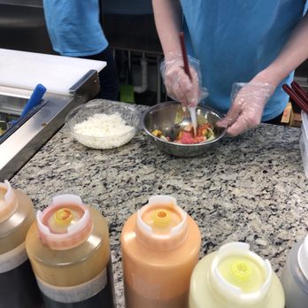 Pokey - Adding in the sushi rice and mixing it all together - Poke Near Me - Norfolk, Virginia Pokey - Adding in the sushi rice and mixing it all together - Poke Near Me - Norfolk, Virginia
