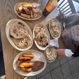 Yucca and Chicharrones, plantain with salvadorean sour cream and beans , revuelta pupusas and cheese and spinach pupusas Yucca and Chicharrones, plantain with salvadorean sour cream and beans , revuelta pupusas and cheese and spinach pupusas