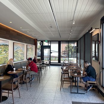 Starbucks - two people sitting at tables in a coffee shop - Coffee & Tea Near Me - Bakersfield, California