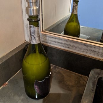 A'Bouzy - Besides the bottles you'll see on the side of the restaurant as you drive into valet; a Dom soap dispenser lol - Champagne Bars Near Me - Houston, Texas A'Bouzy - Besides the bottles you'll see on the side of the restaurant as you drive into valet; a Dom soap dispenser lol - Champagne Bars Near Me - Houston, Texas