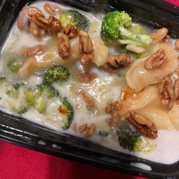 broccoli and walnuts in a creamy sauce broccoli and walnuts in a creamy sauce