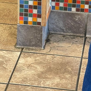 Popeyes Louisiana Kitchen - a person standing on a tiled floor - Fast Food Near Me - Athens, Georgia