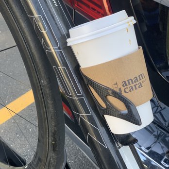 Anam Cara Cafe - a cup of coffee on the handle of a bike - Coffee & Tea Near Me - Libertyville, Illinois