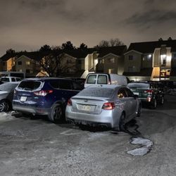 Esprit Cherry Creek Apartments - January cars parked outside parking lines taking up space to drive around.