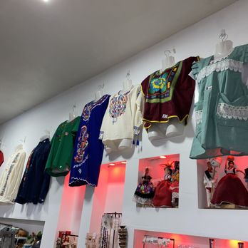 La Flama - a variety of clothing hanging on a wall - Specialty Food Near Me - Los Angeles, California La Flama - a variety of clothing hanging on a wall - Specialty Food Near Me - Los Angeles, California