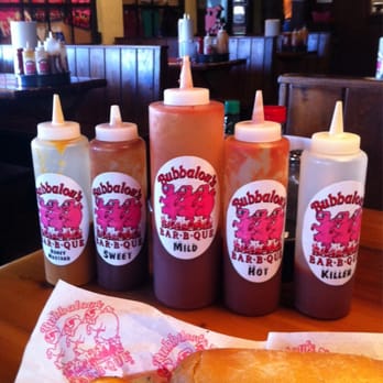 Bubbalou's Bodacious BBQ - Gotta love when each table is stacked with sauce options AND they're all labeled! - Barbeque Near Me - Altamonte Springs, Florida