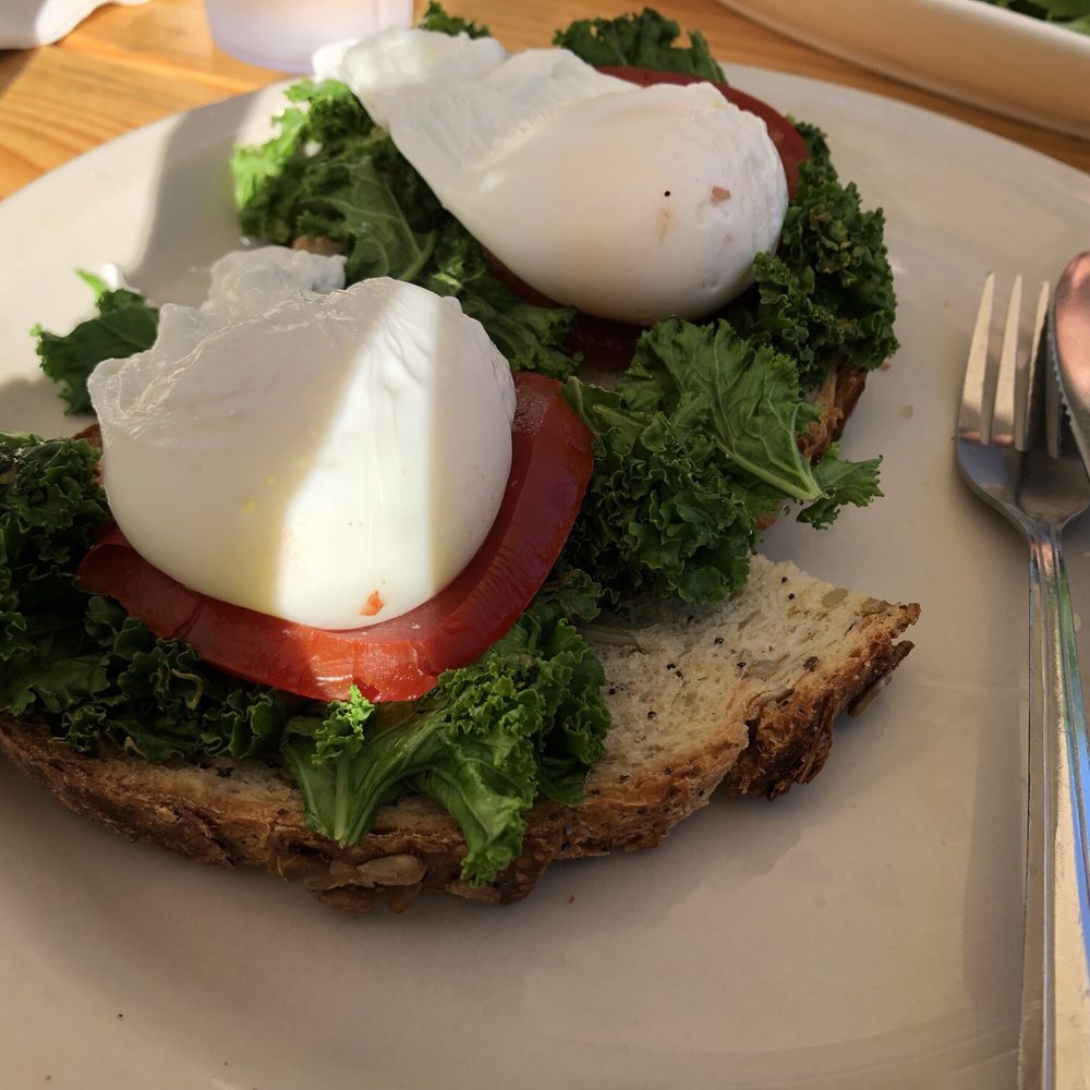 Cenote - Poached eggs on kale and tomato with toast - Coffee & Tea Near Me - Austin, Texas Cenote - Poached eggs on kale and tomato with toast - Coffee & Tea Near Me - Austin, Texas