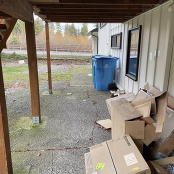 Pacific Living Construction - a pile of cardboard boxes - General Contractors Near Me