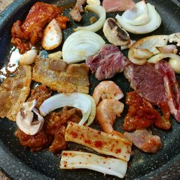 a plate of meat and vegetables a plate of meat and vegetables