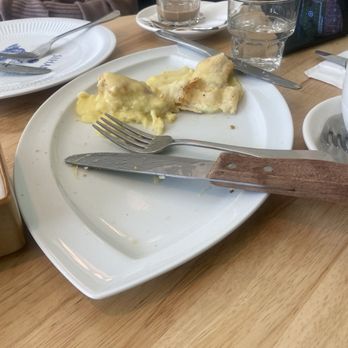 Sihana Café - Remains of the Adjaruli, cheesy bread with a poached eggs - Coffee & Tea Near Me - Newark, New Jersey Sihana Café - Remains of the Adjaruli, cheesy bread with a poached eggs - Coffee & Tea Near Me - Newark, New Jersey