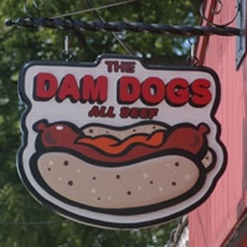 The Dam Dogs - a hot dog hanging from the side of a building - Hot Dogs Near Me - Rockford, Michigan The Dam Dogs - a hot dog hanging from the side of a building - Hot Dogs Near Me - Rockford, Michigan