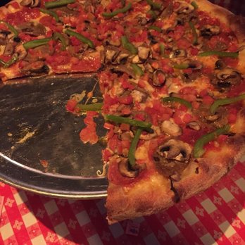 Home Slice Pizza - Before it's gone, but that's a medium pie. - Pizza Near Me - Austin, Texas
