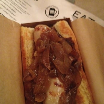 Lowry Beer Garden - My veal brat w/ the BOMB topping. Check out that bread! - Burgers Near Me - Denver, Colorado