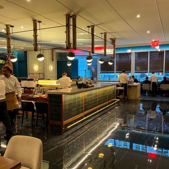 Dabble - a view of a restaurant with people sitting at the bar - Bars Near Me - New York, New York Dabble - a view of a restaurant with people sitting at the bar - Bars Near Me - New York, New York
