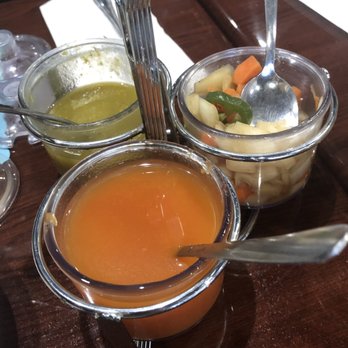 El Rinconcito Salvadoreno 2 - 3 sauces for the pupusa: light vinegary tomato, green hot salsa, chunky (onions, jalapeños, carrots) pickled in medium spicy base. - Salvadoran Near Me - Pompano Beach, Florida