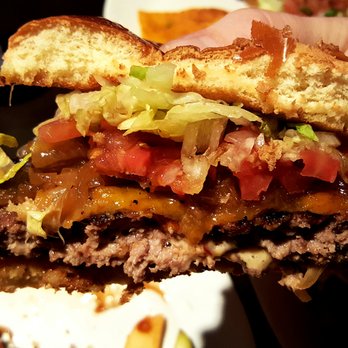 Coaches Bar & Grill - An oldie but a goodie, the bacon cheeseburger, loaded with veg, simmered & saucey, sandwiched between a sweet roll. - Sports Bars Near Me - Bloomington, Indiana
