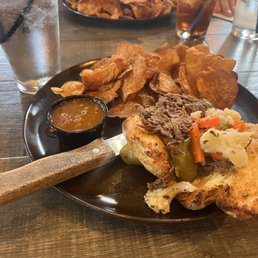 Phoenix Upper Main - Italian Beef Sandwich and house made chips. Split into two plates. Phoenix Upper Main - Italian Beef Sandwich and house made chips. Split into two plates.